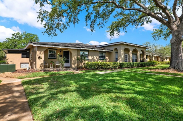 516 Polaris Loop Unit 110, Casselberry, FL 32707 - view of front of house featuring a front lawn and stucco siding