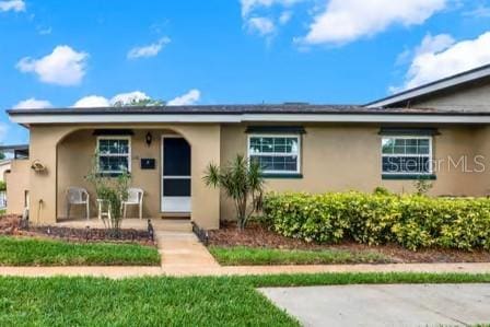 516 Polaris Loop Unit 110, Casselberry, FL 32707 - view of front facade featuring stucco siding