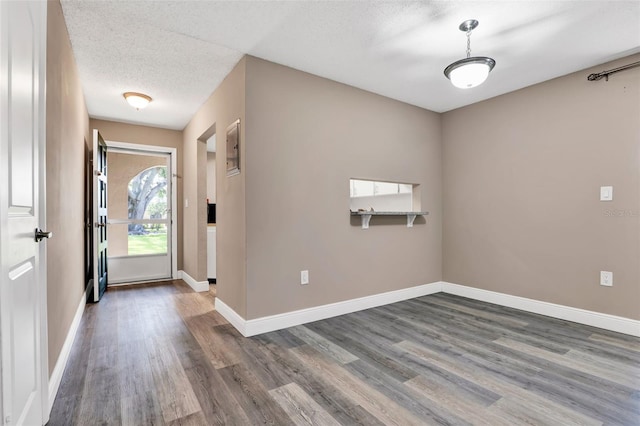516 Polaris Loop Unit 110, Casselberry, FL 32707 - foyer entrance with baseboards, dark wood-style floors, and a textured ceiling