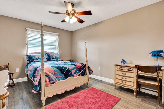 516 Polaris Loop Unit 110, Casselberry, FL 32707 - bedroom with baseboards, a ceiling fan, and wood finished floors
