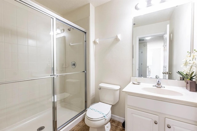 550 Las Fuentes Dr, Kissimmee, FL 34746 - full bathroom featuring vanity, toilet, a stall shower, and tile patterned floors