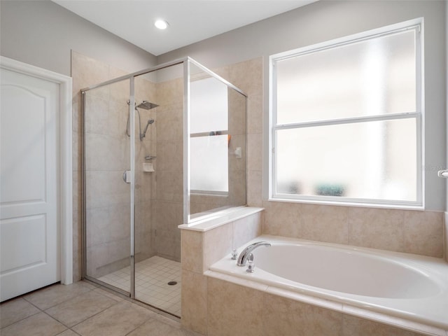 full bath featuring a bath, tile patterned floors, and a stall shower