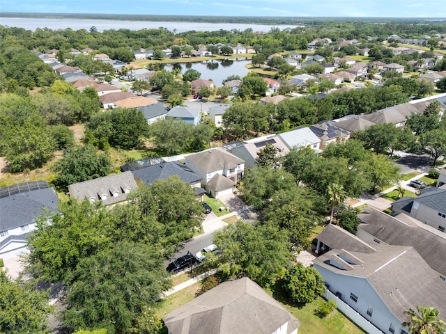 drone / aerial view with a residential view and a water view