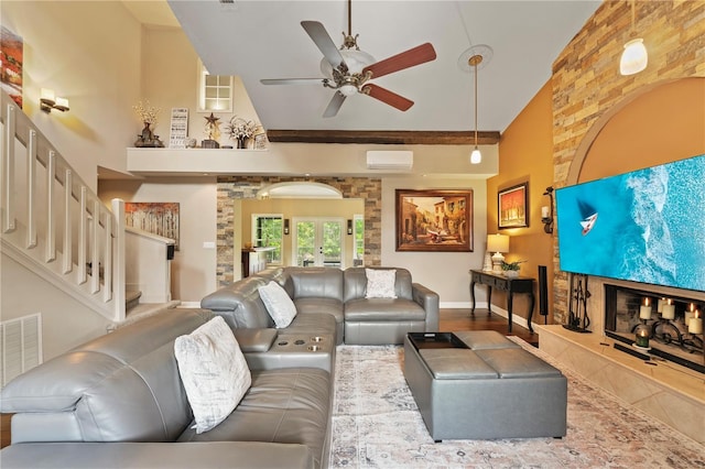 14037 Fairway Willow Ln, Winter Garden, FL 34787 - living room with a ceiling fan, high vaulted ceiling, an AC wall unit, and stairway