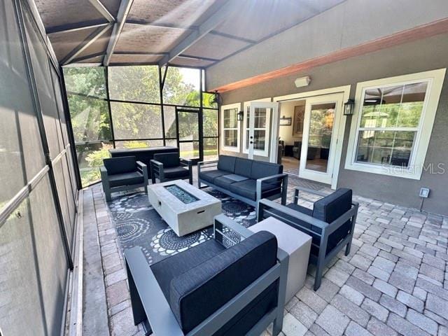 14037 Fairway Willow Ln, Winter Garden, FL 34787 - view of patio featuring an outdoor living space with a fire pit