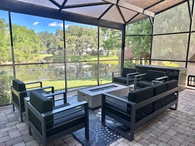 14037 Fairway Willow Ln, Winter Garden, FL 34787 - view of patio with an outdoor living space with a fire pit and glass enclosure