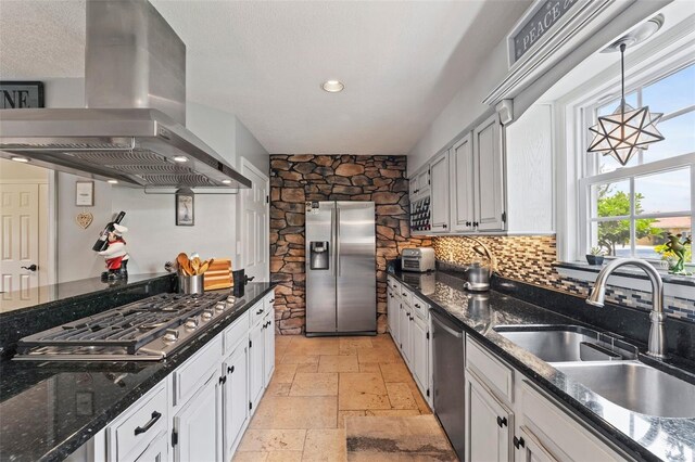 14037 Fairway Willow Ln, Winter Garden, FL 34787 - kitchen featuring range hood, stainless steel appliances, stone tile flooring, healthy amount of natural light, and recessed lighting