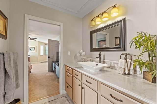 14037 Fairway Willow Ln, Winter Garden, FL 34787 - ensuite bathroom featuring vanity, tile patterned flooring, and a ceiling fan