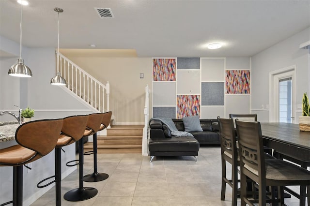 3806 Lana Ave, Davenport, FL 33897 - dining area with stairs and light tile patterned flooring
