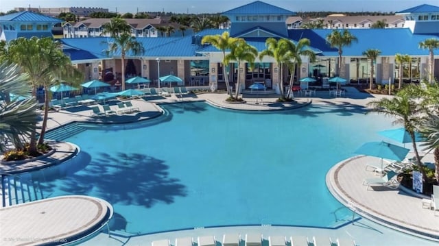 3806 Lana Ave, Davenport, FL 33897 - community pool featuring a residential view and a patio area