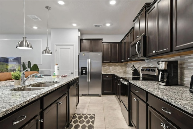 3806 Lana Ave, Davenport, FL 33897 - kitchen featuring stainless steel appliances, tasteful backsplash, light stone counters, dark brown cabinets, and light tile patterned floors