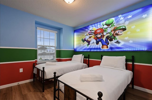3806 Lana Ave, Davenport, FL 33897 - bedroom with wood finished floors and a textured ceiling