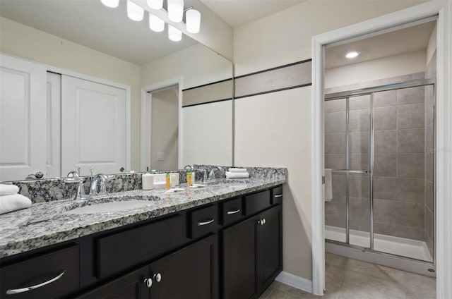 3806 Lana Ave, Davenport, FL 33897 - bathroom featuring double vanity, a shower stall, and tile patterned floors