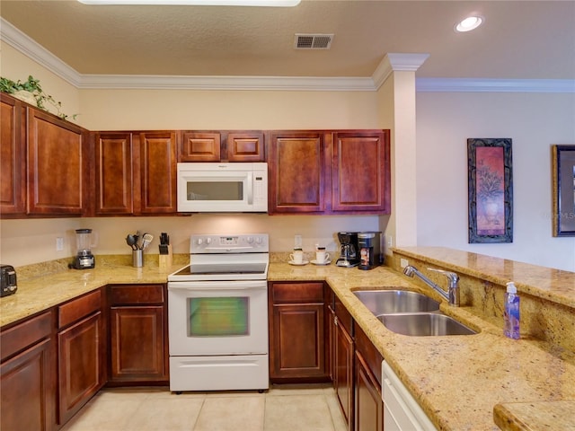 kitchen with white appliances, crown molding, visible vents, and a sink