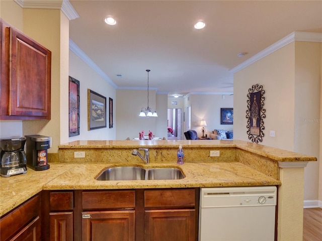 kitchen featuring a sink, light stone counters, a peninsula, and dishwasher