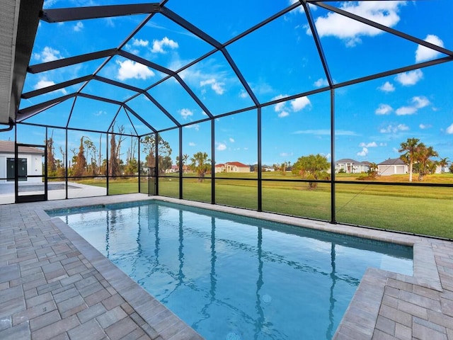 pool featuring a lawn, a patio, and glass enclosure