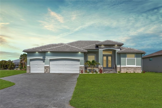 209 Rotonda Blvd S, Rotonda West, FL 33947 - view of front of property with french doors, a garage, decorative driveway, and stone siding