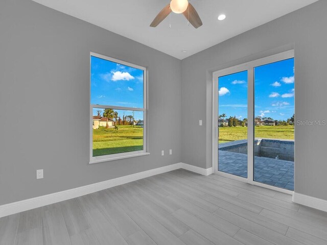 193 Rotonda Blvd S, Rotonda West, FL 33947 - spare room with baseboards, wood finished floors, recessed lighting, and ceiling fan
