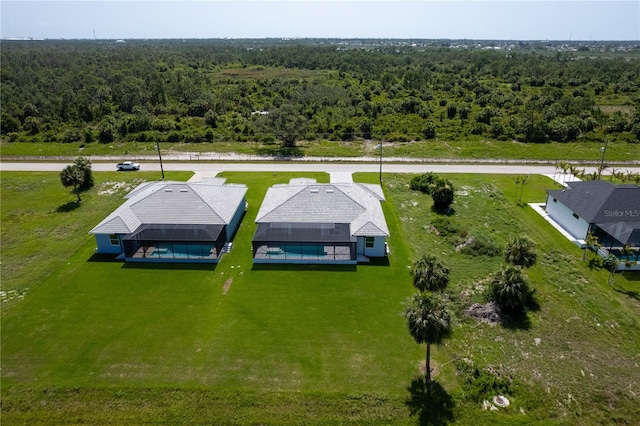 221 Rotonda Blvd S, Rotonda West, FL 33947 - aerial view of property and surrounding area with a heavily wooded area