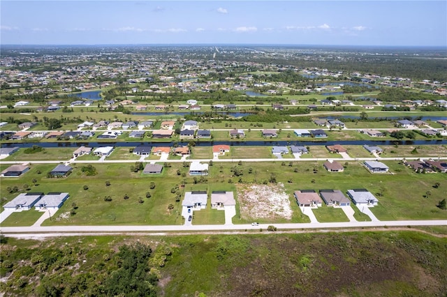 235 Rotonda Blvd S, Rotonda West, FL 33947 - aerial view of property and surrounding area with a large body of water and nearby suburban area