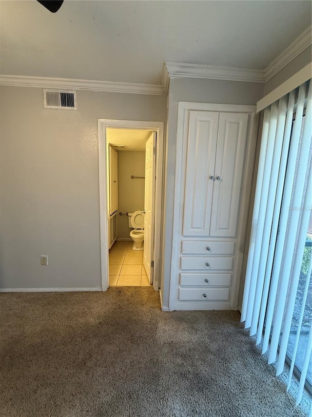 131 Water Front Way Unit 110, Altamonte Springs, FL 32701 - unfurnished bedroom with carpet flooring, connected bathroom, baseboards, visible vents, and ornamental molding