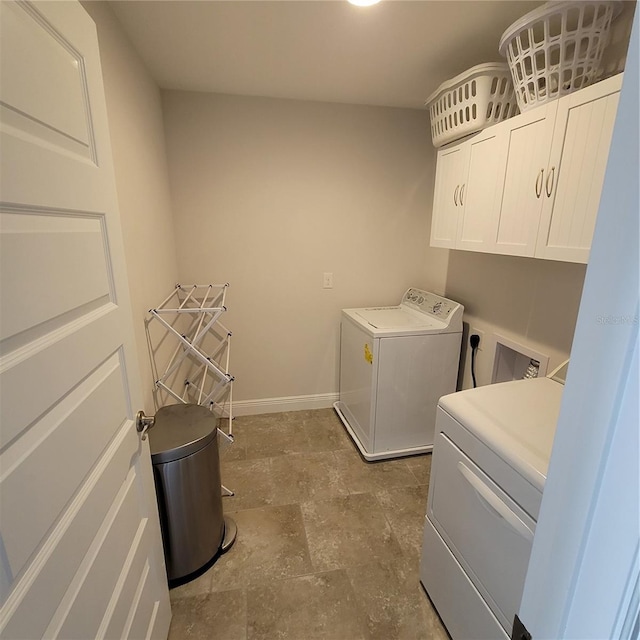 16124 Azure Key St, Winter Garden, FL 34787 - laundry area featuring electric dryer hookup, cabinet space, stone finish flooring, and baseboards