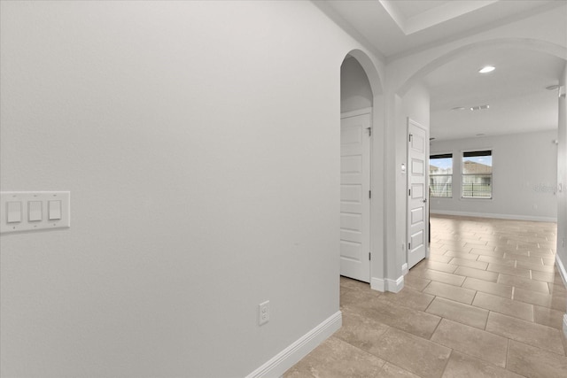 16124 Azure Key St, Winter Garden, FL 34787 - hallway with arched walkways, baseboards, and recessed lighting