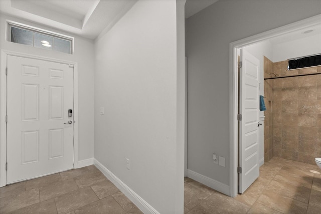 16124 Azure Key St, Winter Garden, FL 34787 - entryway featuring baseboards and stone finish floors