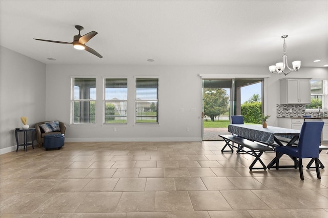 16124 Azure Key St, Winter Garden, FL 34787 - dining area with baseboards, a chandelier, a ceiling fan, and recessed lighting