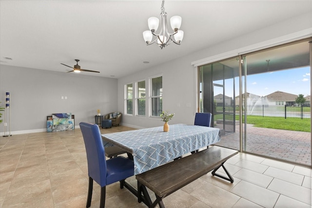 16124 Azure Key St, Winter Garden, FL 34787 - dining room featuring ceiling fan, a chandelier, light tile patterned floors, and baseboards