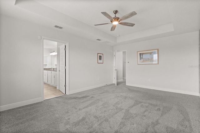 16124 Azure Key St, Winter Garden, FL 34787 - unfurnished room featuring a raised ceiling, ceiling fan, light colored carpet, and baseboards