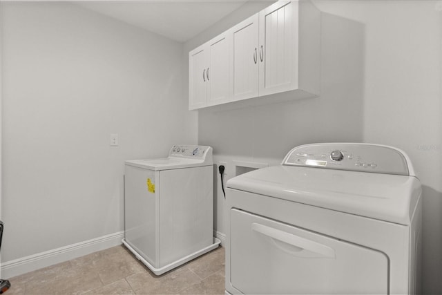 16124 Azure Key St, Winter Garden, FL 34787 - washroom with cabinet space, washing machine and clothes dryer, and baseboards