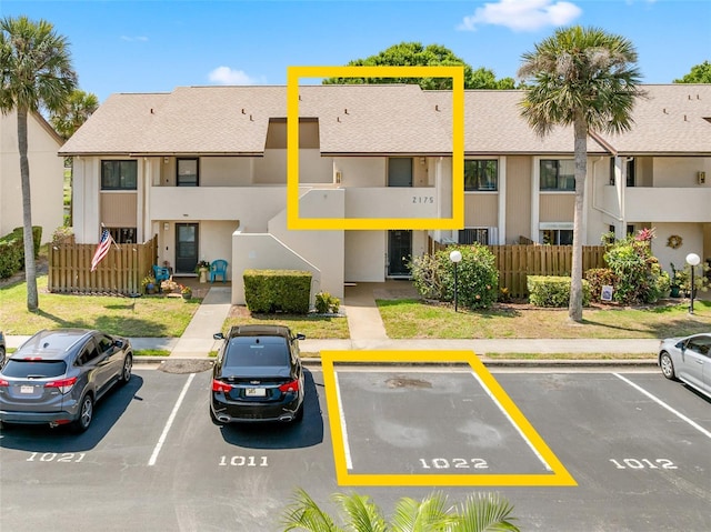 2175 Golf Isle Dr Unit 1022, Melbourne, FL 32935 - uncovered parking lot with fence