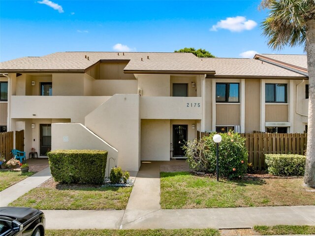 2175 Golf Isle Dr Unit 1022, Melbourne, FL 32935 - view of building exterior with fence