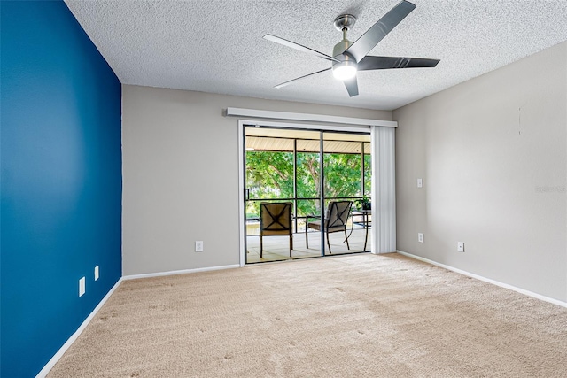 2175 Golf Isle Dr Unit 1022, Melbourne, FL 32935 - unfurnished room with carpet floors, a ceiling fan, a textured ceiling, and baseboards