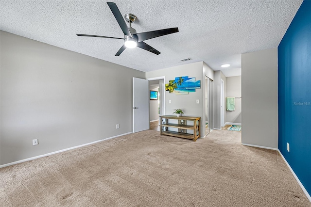 2175 Golf Isle Dr Unit 1022, Melbourne, FL 32935 - carpeted empty room with baseboards, a ceiling fan, a textured ceiling, and visible vents
