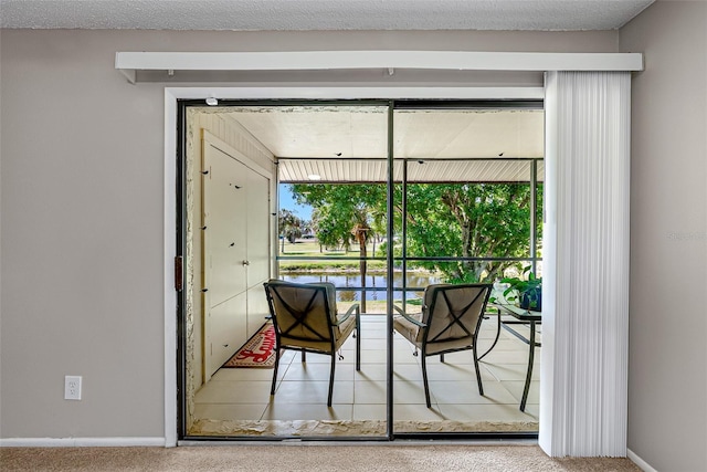 2175 Golf Isle Dr Unit 1022, Melbourne, FL 32935 - doorway to outside with carpet floors and baseboards