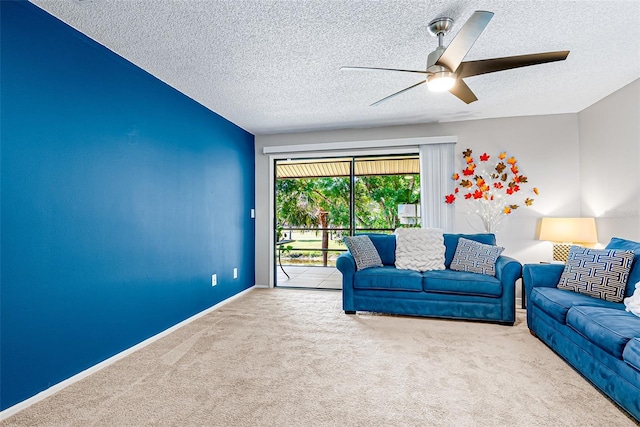 2175 Golf Isle Dr Unit 1022, Melbourne, FL 32935 - carpeted living room with baseboards, ceiling fan, and a textured ceiling