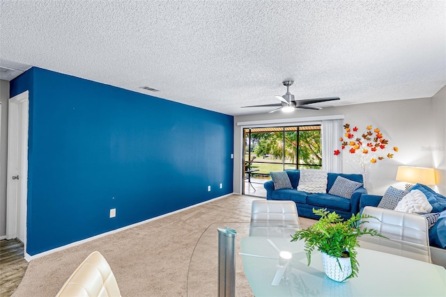 2175 Golf Isle Dr Unit 1022, Melbourne, FL 32935 - living room with a ceiling fan, a textured ceiling, visible vents, carpet floors, and baseboards