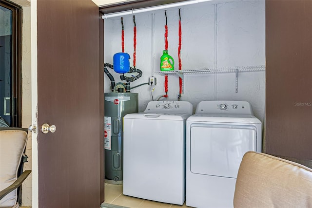 2175 Golf Isle Dr Unit 1022, Melbourne, FL 32935 - laundry area with water heater, laundry area, and washing machine and dryer