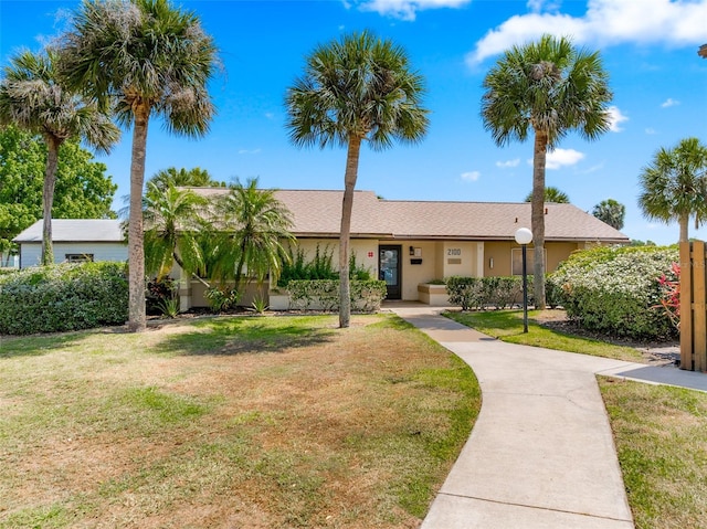 2175 Golf Isle Dr Unit 1022, Melbourne, FL 32935 - ranch-style house with a front lawn and stucco siding