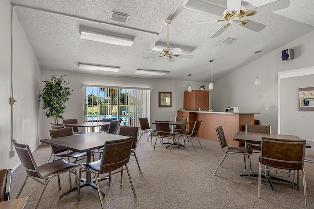 2175 Golf Isle Dr Unit 1022, Melbourne, FL 32935 - dining space with visible vents, a textured ceiling, ceiling fan, and light colored carpet
