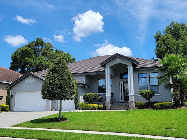 603 Sanctuary Golf Pl, Apopka, FL 32712 - single story home with an attached garage, driveway, a front yard, and stucco siding
