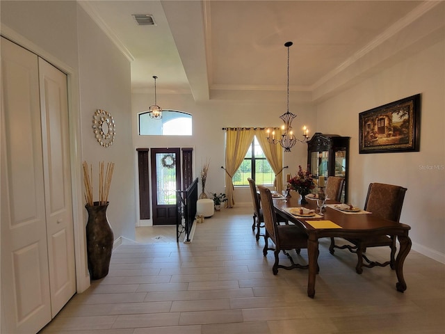 603 Sanctuary Golf Pl, Apopka, FL 32712 - dining room with light wood-style flooring, visible vents, crown molding, and an inviting chandelier