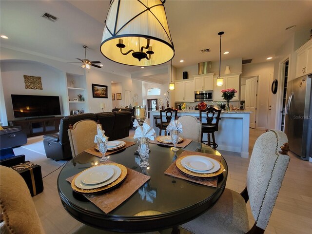 603 Sanctuary Golf Pl, Apopka, FL 32712 - dining room featuring built in shelves, ceiling fan, and visible vents