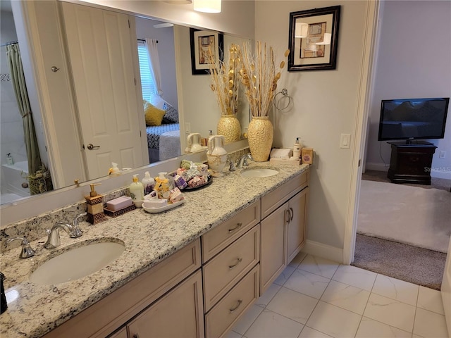 603 Sanctuary Golf Pl, Apopka, FL 32712 - ensuite bathroom featuring double vanity, marble finish floor, ensuite bathroom, and a sink