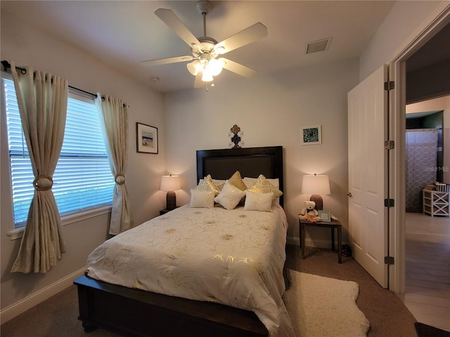 603 Sanctuary Golf Pl, Apopka, FL 32712 - bedroom with baseboards, a ceiling fan, carpet flooring, and visible vents