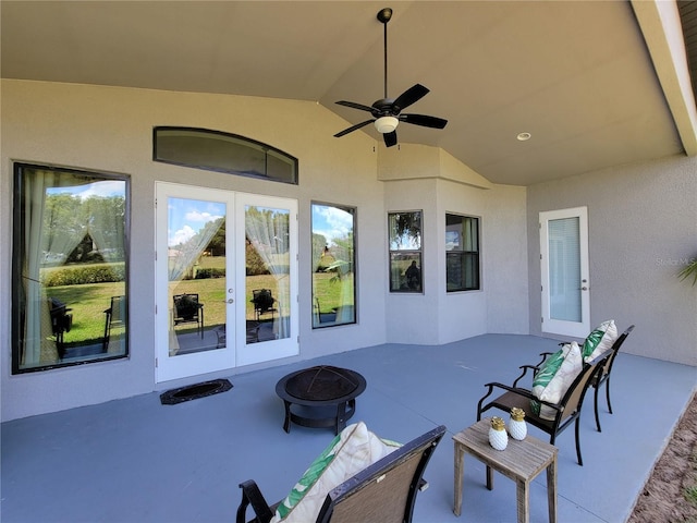603 Sanctuary Golf Pl, Apopka, FL 32712 - view of patio / terrace with ceiling fan, a fire pit, and french doors