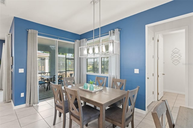 dining room with baseboards, light tile patterned flooring, and visible vents