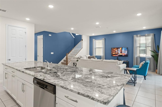 kitchen featuring stainless steel dishwasher, visible vents, recessed lighting, a sink, and light tile patterned floors
